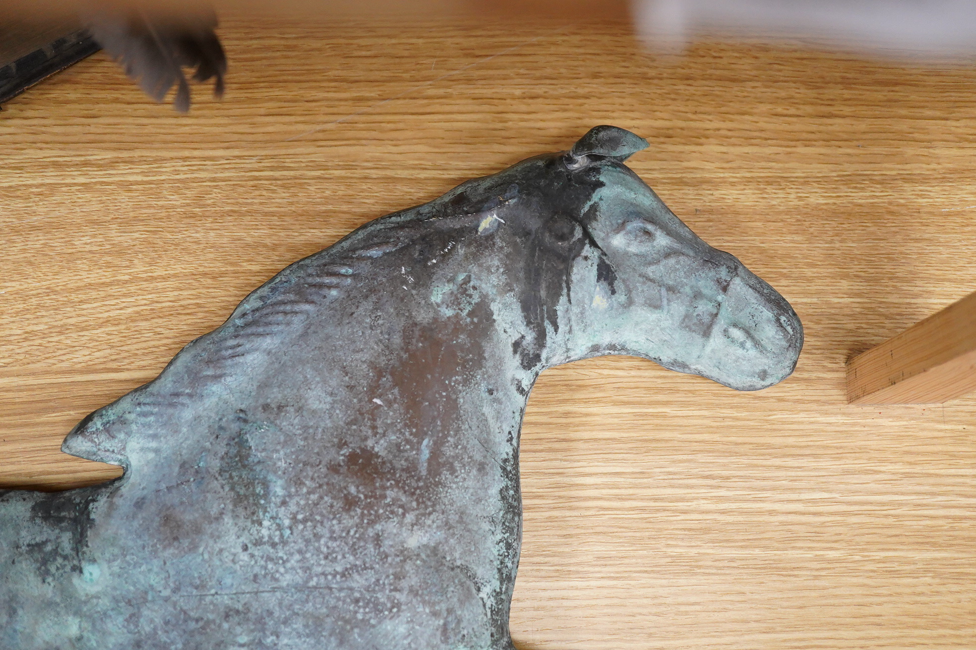 A copper ‘horse’ weather vane, 71cm wide.